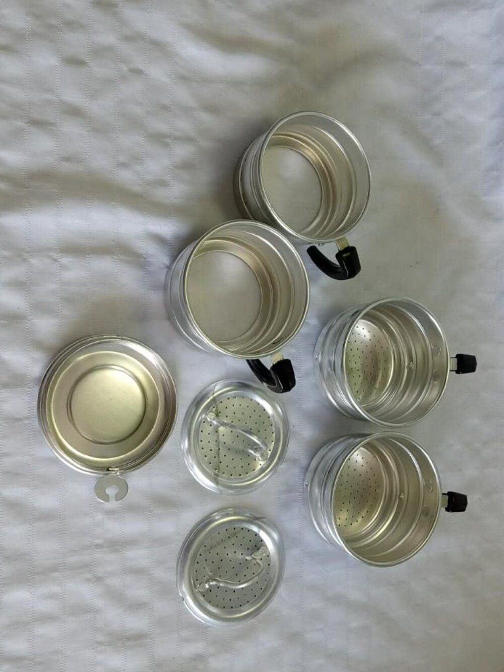 Set of vintage aluminum coffee filters and cups circa 1940